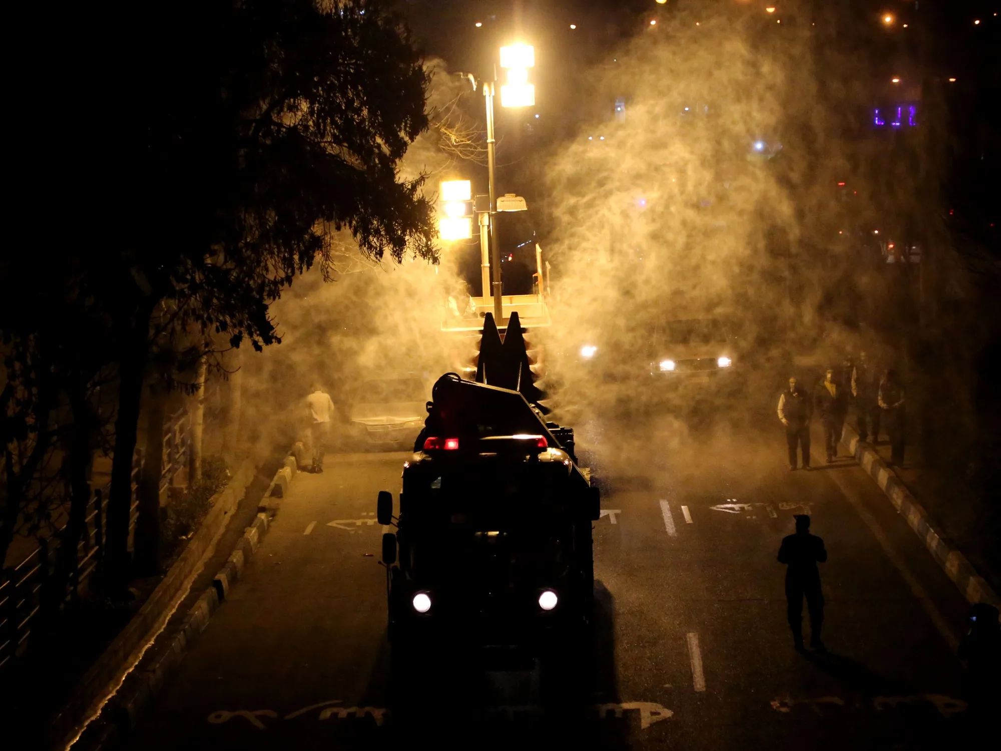Firefighter carry out disinfection works in Tehran, on March 11.