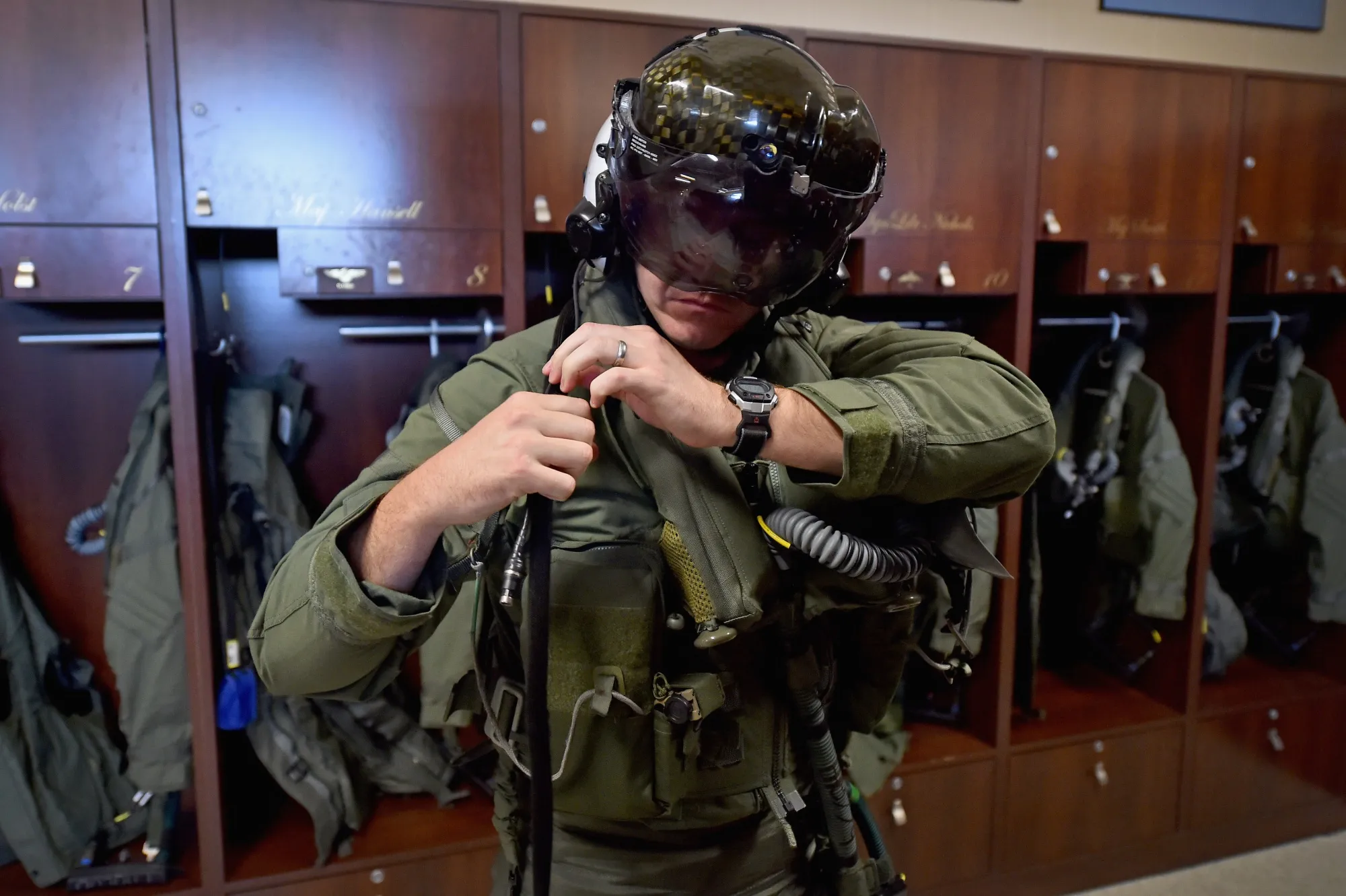 A US Marine Corps major dresses in a flight suit and helmet worn to fly the F-35B Lightning II aircraft&nbsp;in Beaufort, South Carolina. Defense equipment business Beaufort&nbsp;provides pilot flight gear to the US Department of Defense and other militaries.