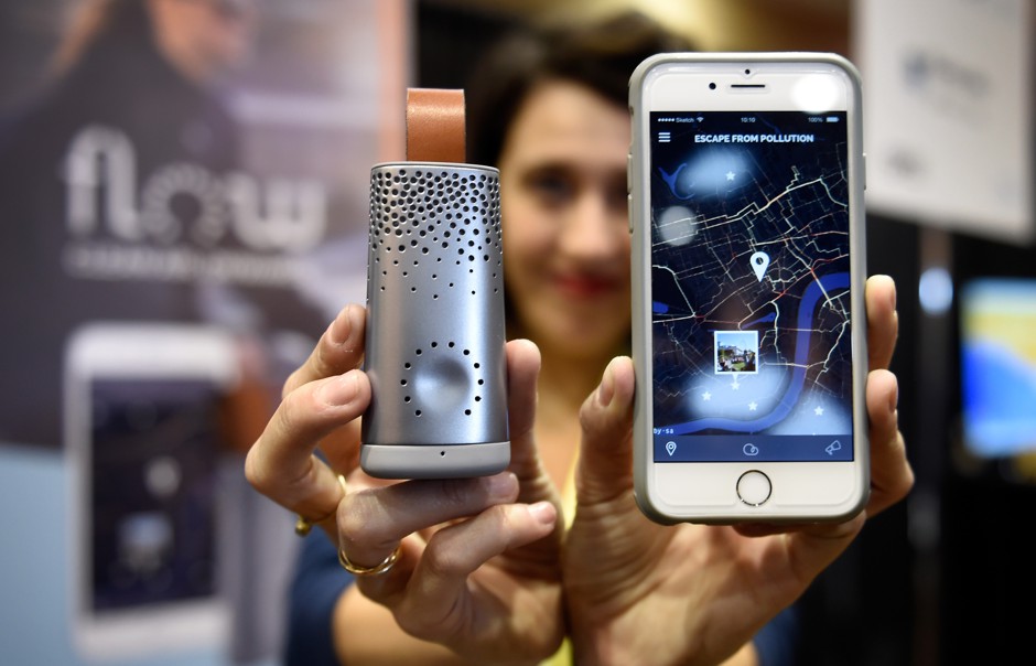 Flow, a new air-quality sensor, and its companion app are displayed during a press event for CES 2017 on January 3, 2017 in Las Vegas. 