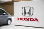 The Honda Motor Co. logo is displayed outside the venue for a media preview of the N-Box minicar in Tokyo, Japan, on Tuesday, July 4, 2017. Honda will start to sell the new N-BOX, Japan's best-selling ultra-compact "kei" car, on Friday, Sept. 1, 2017.