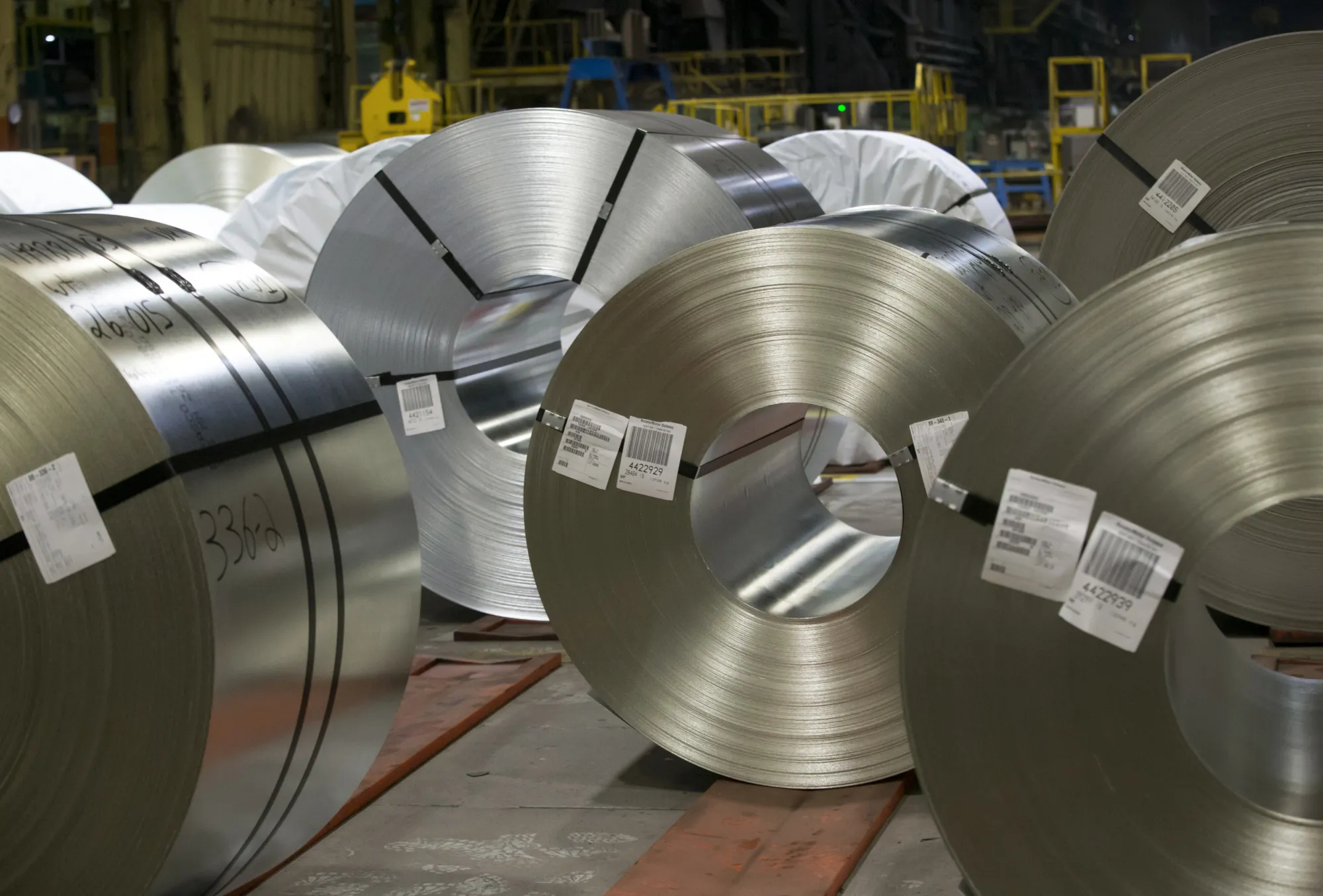 Steel coils sit at the ArcelorMittal Dofasco Inc. galvanizing mill in Hamilton, Ontario, Canada.