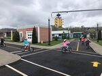Young cyclists learn the rules of the road at the Chautauqua Children’s Safety Education Village in Ashville, New York, which opened in 2010.