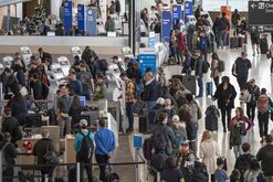 Travelers At SFO Airport Ahead Of Christmas Holiday
