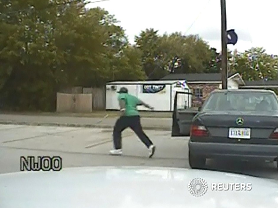 A still image taken from police dash cam video allegedly shows Walter Scott running from his vehicle during a traffic stop before he was shot and killed by white police officer Michael Slager in North Charleston, South Carolina April 7, 2015. The footage, released by the South Carolina Law Enforcement Division on April 9, 2015, was taken minutes before a bystander's video recorded Slager gunning down 50-year-old Scott as he fled.