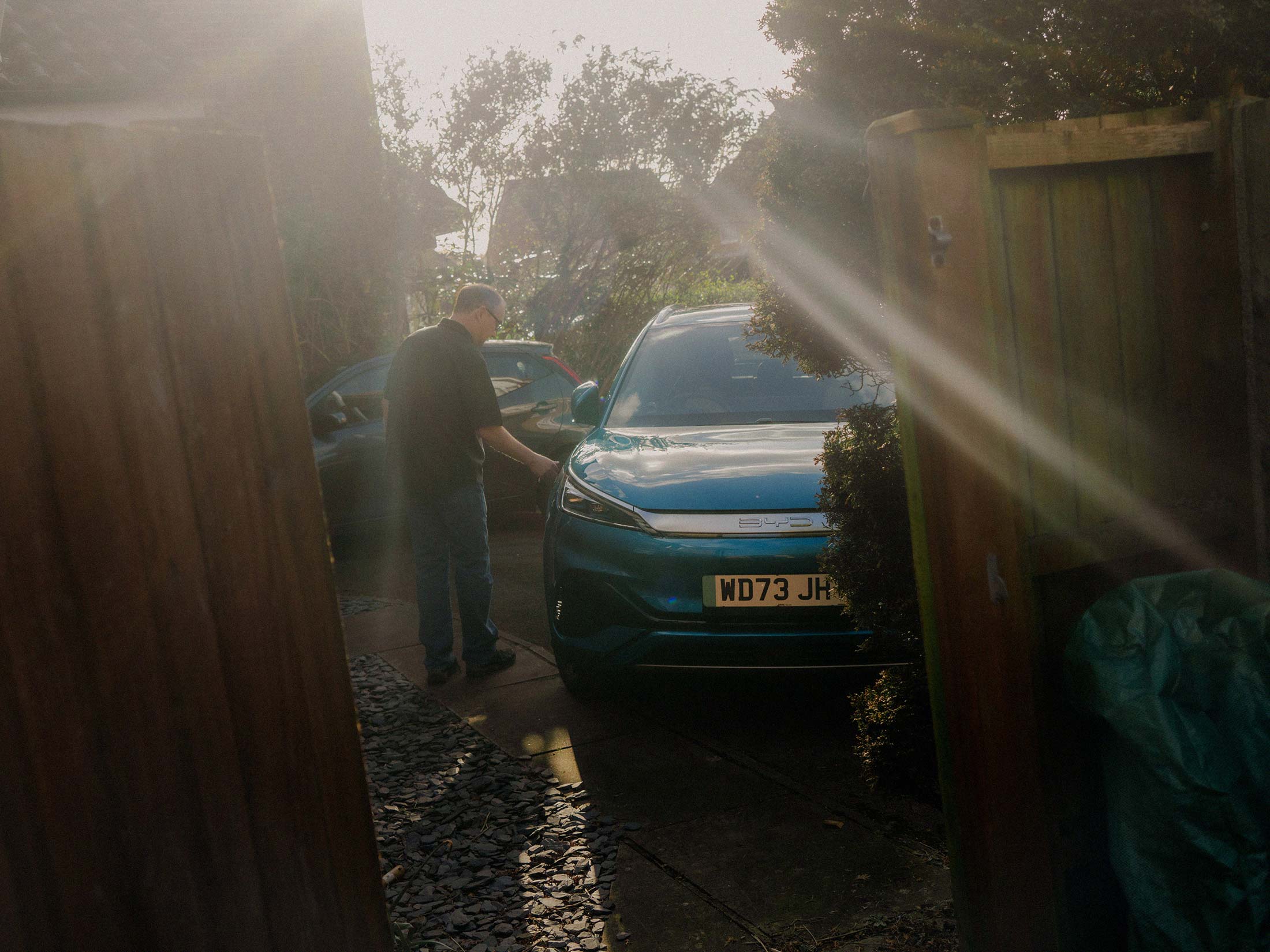 Kevin Wood with his electric vehicle outside his home in Hampshire, UK, in March.&nbsp;