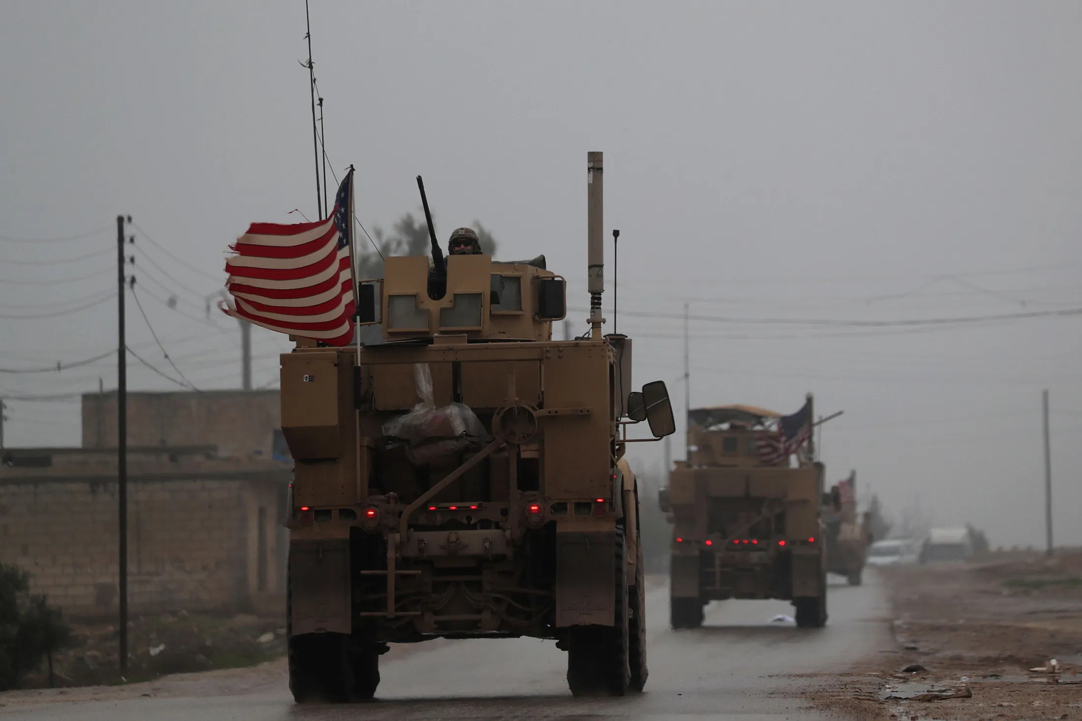 A line of US military vehicles in Syria's northern city of Manbij on Dec. 30, 2018.