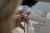 A healthcare worker prepares a dose of the Moderna Covid-19 vaccine at a McLeod Health mass vaccination site inside the Darlington Raceway in Darlington.