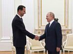 Vladimir Putin, right, with Bashar al-Assad at the Kremlin in Moscow on Sept. 13.