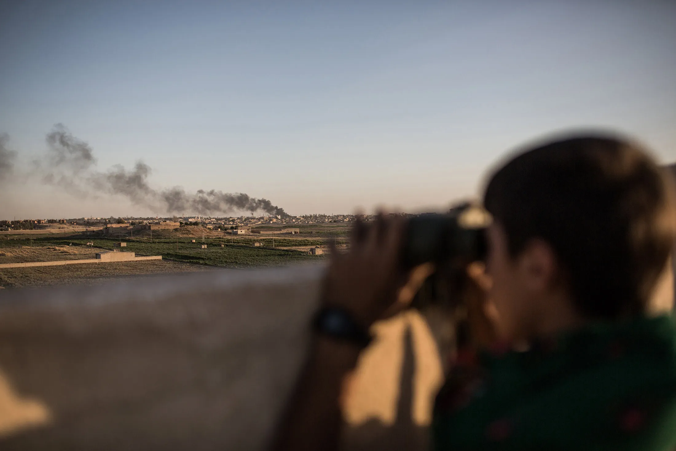 Kurdish fighters are pictured during a clashes with fighters from the Islamic State group on the outskirts of Syrian city of Hasekeh on June 30, 2015.

