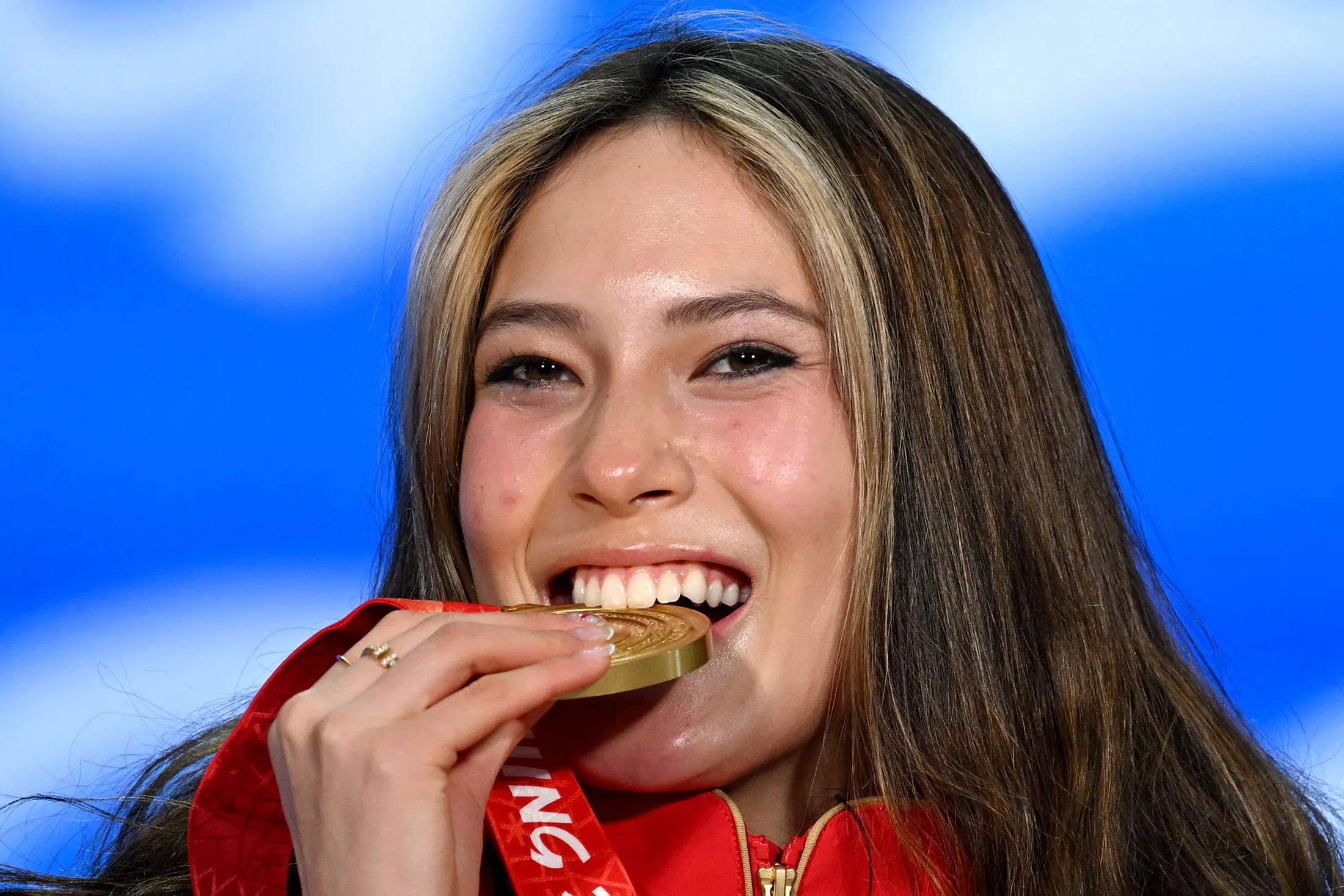 Gu celebrates on the podium during the freestyle skiing women’s freeski big air victory ceremony on Feb. 8.