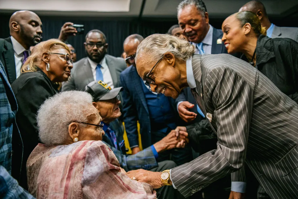 Hughes Van Ellis and Viola Fletcher are greeted by Al Sharpton in Tulsa, Oklahoma.