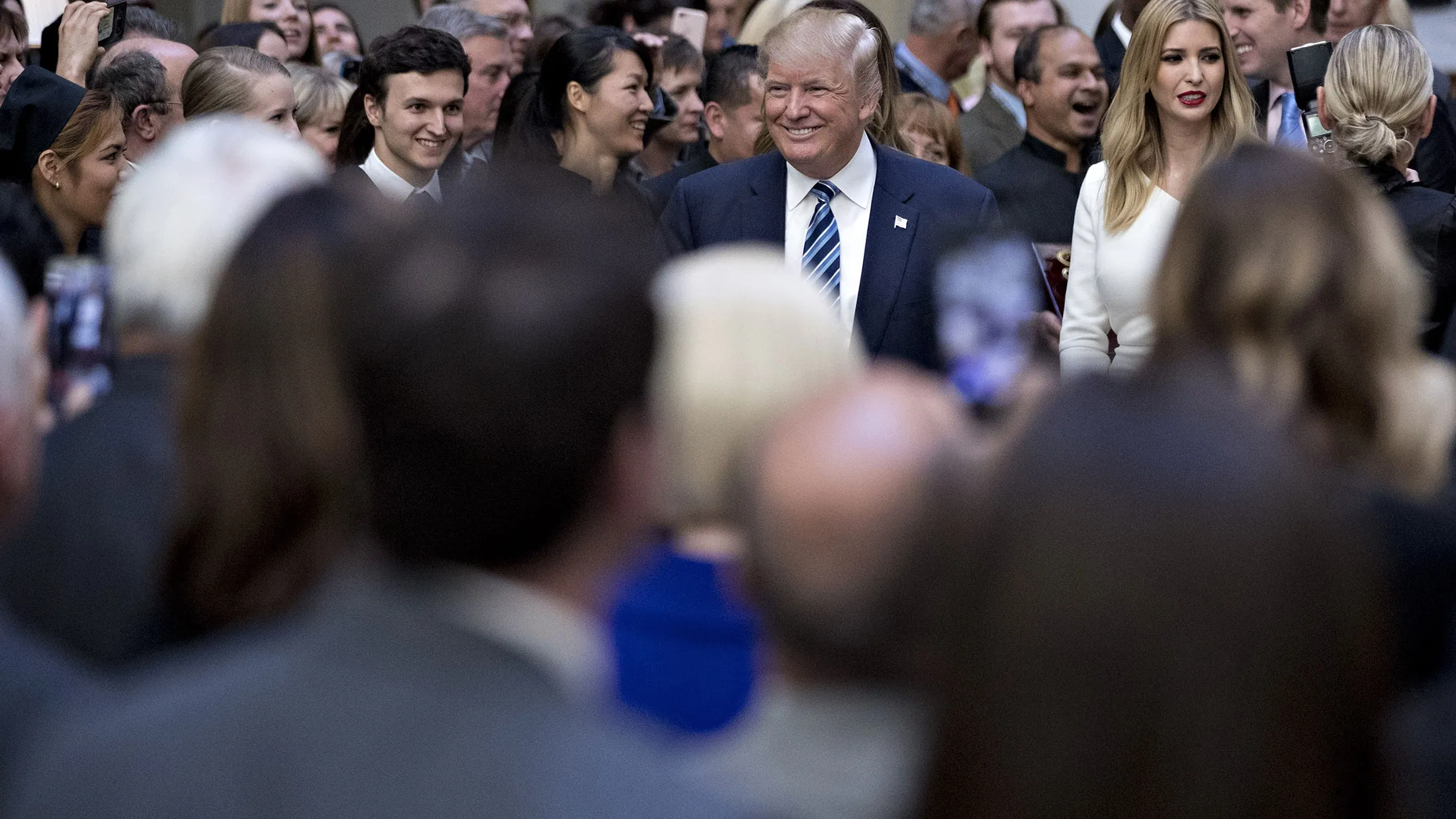Donald Trump arrives with his family before a ribbon-cutting during the grand opening ceremony of the Trump International Hotel in Washington on Oct. 26, 2016.
