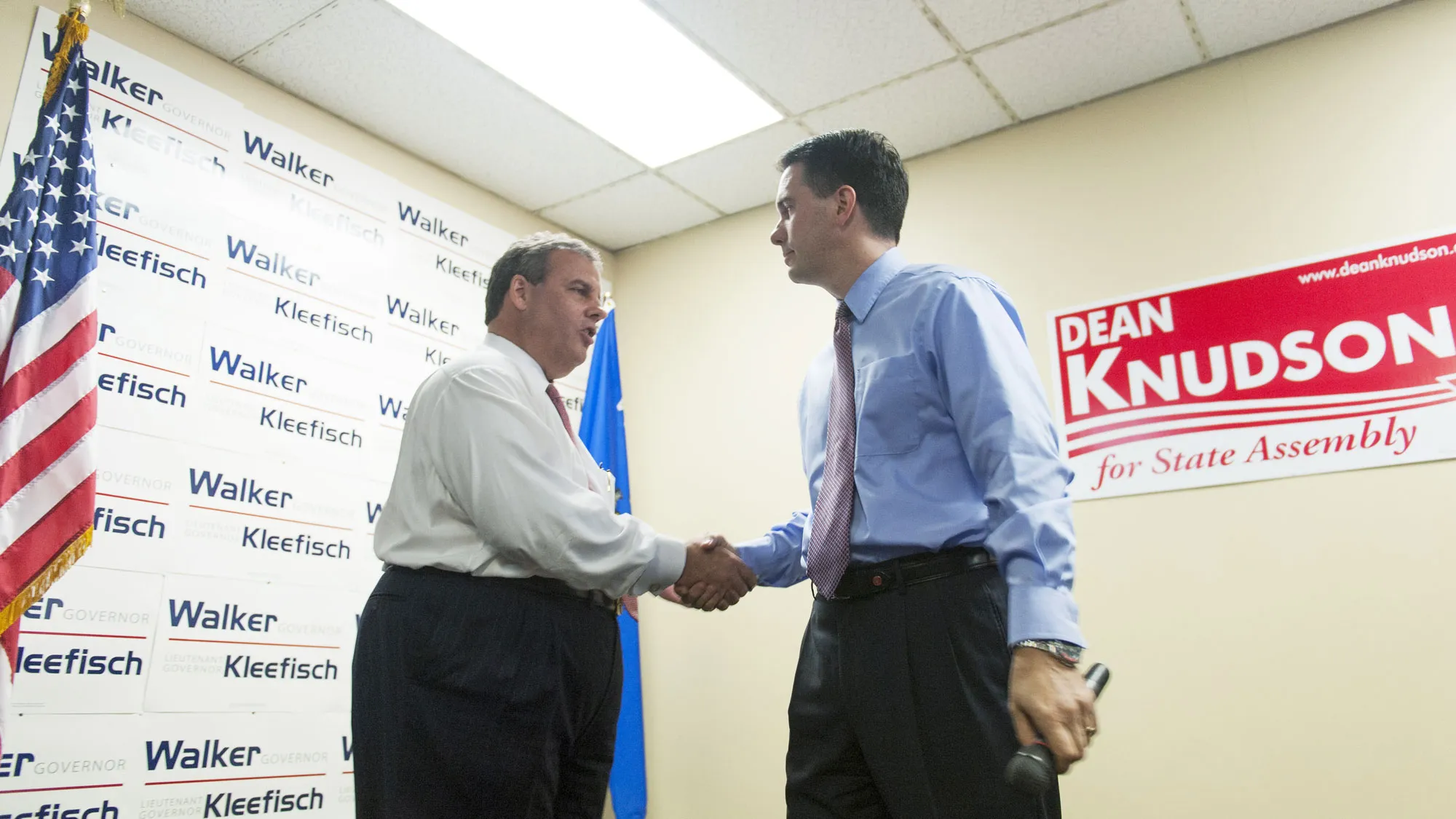 New Jersey Gov. Chris Christie (R) as Wisconsin Gov. Scott Walker listens during a campaign stop at the GOP Field office September 29, 2014 in Hudson, Wisconsin.
