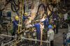Sparks fly as employees work in the weld shop at the SAIC-GM-Wuling Automobile Co. Baojun Base plant, a joint venture between SAIC Motor Corp., General Motors Co. and Liuzhou Wuling Automobile Industry Co., in Liuzhou, Guangxi province, China, on Wednesday, May 23, 2018. GM and its partners sold 4 million vehicles in China in 2017, about 1 million more than the automaker sold in the U.S.