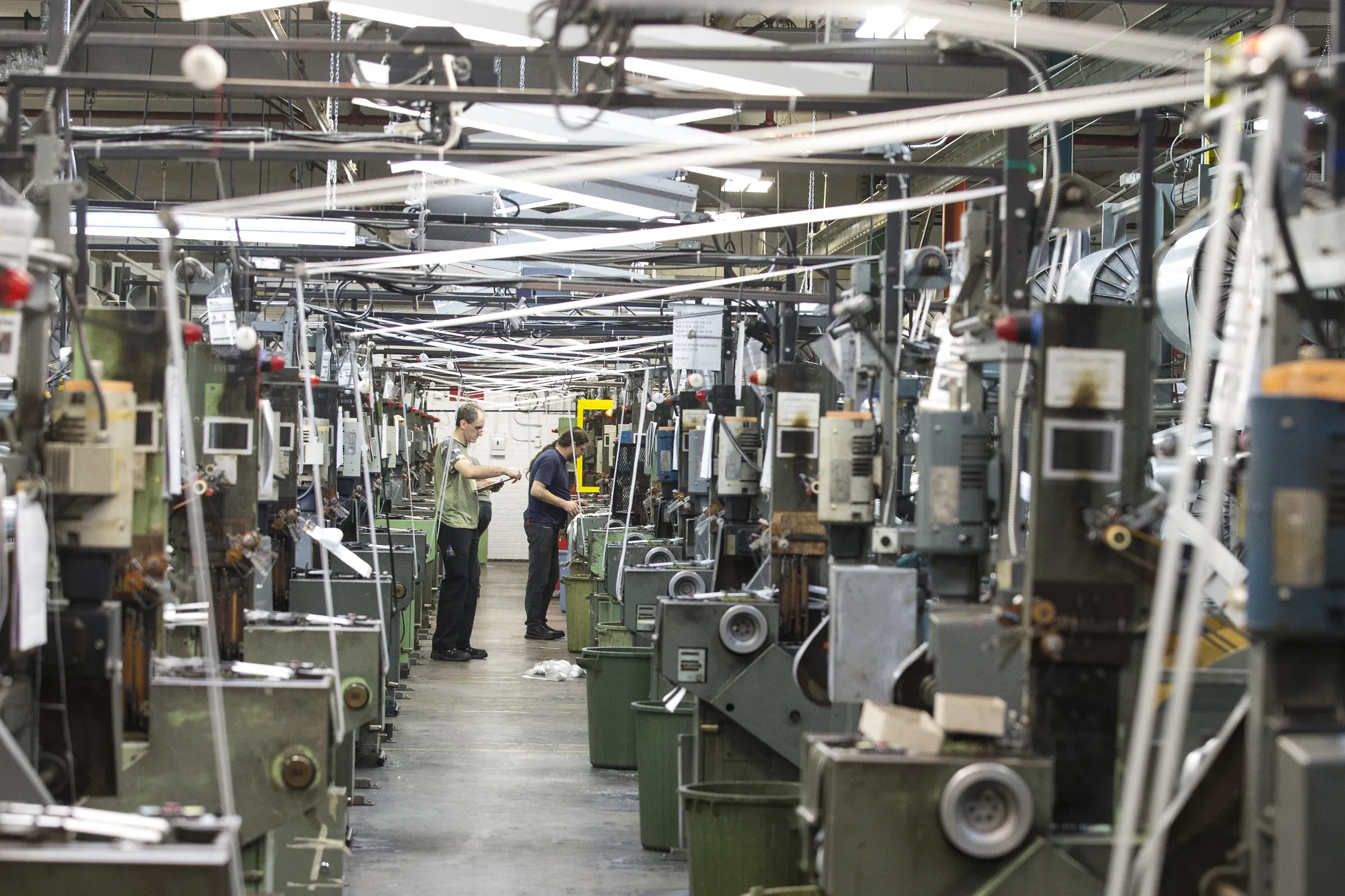Workers inspect looms at a&nbsp;factory in Granby, Quebec, Canada.