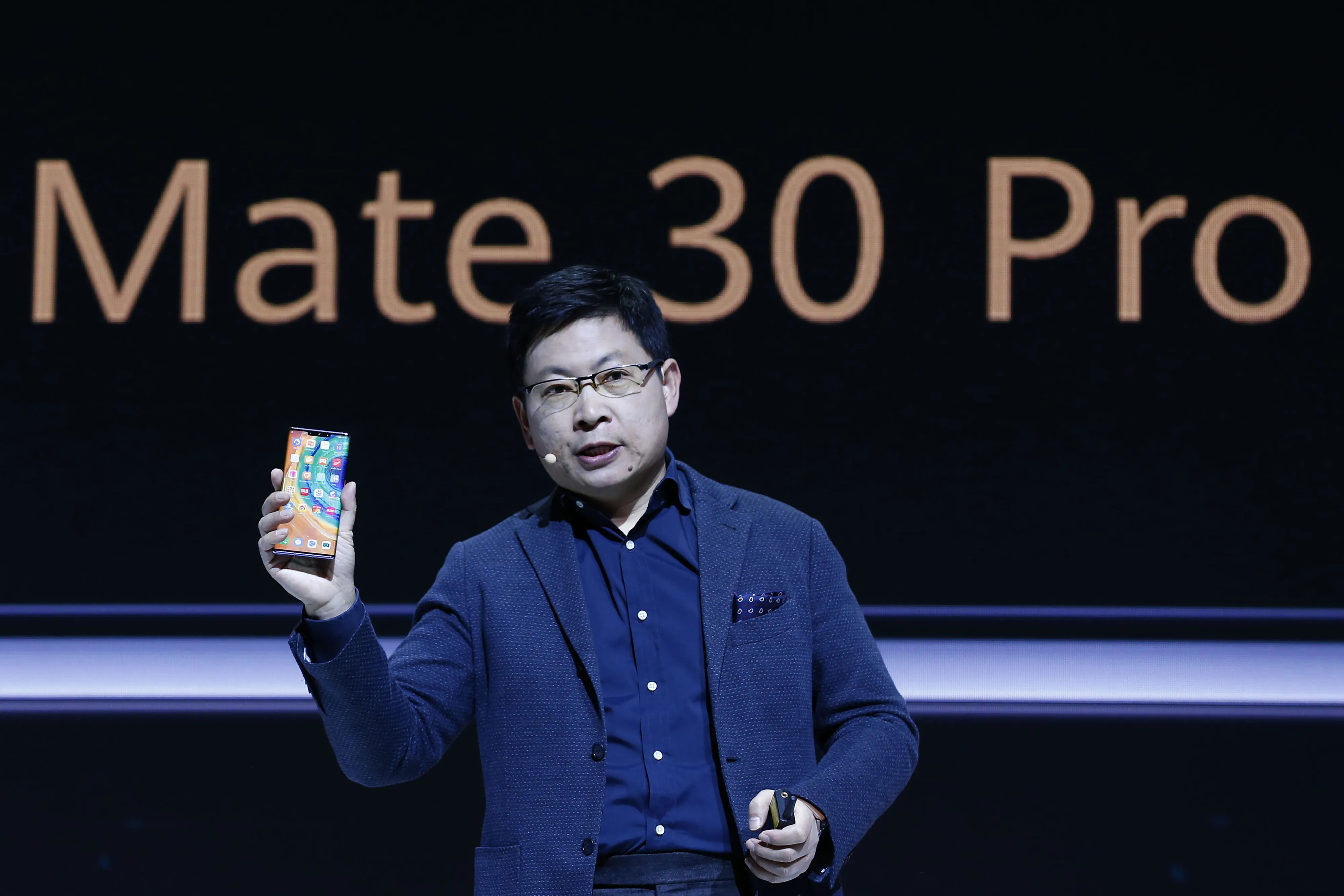 Richard Yu holds the Huawei Mate 30 smartphone in Munich on Sept. 19.