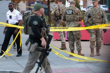 Law enforcement and National Guard troops respond to a shooting near the White House on Nov. 26.
