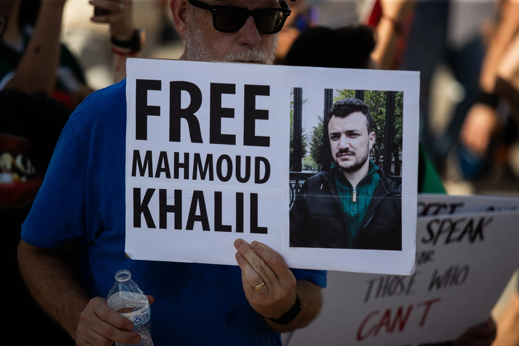 A protester holds a sign during a demonstration at Ervan Chew Park in Houston, Texas, on June 8.