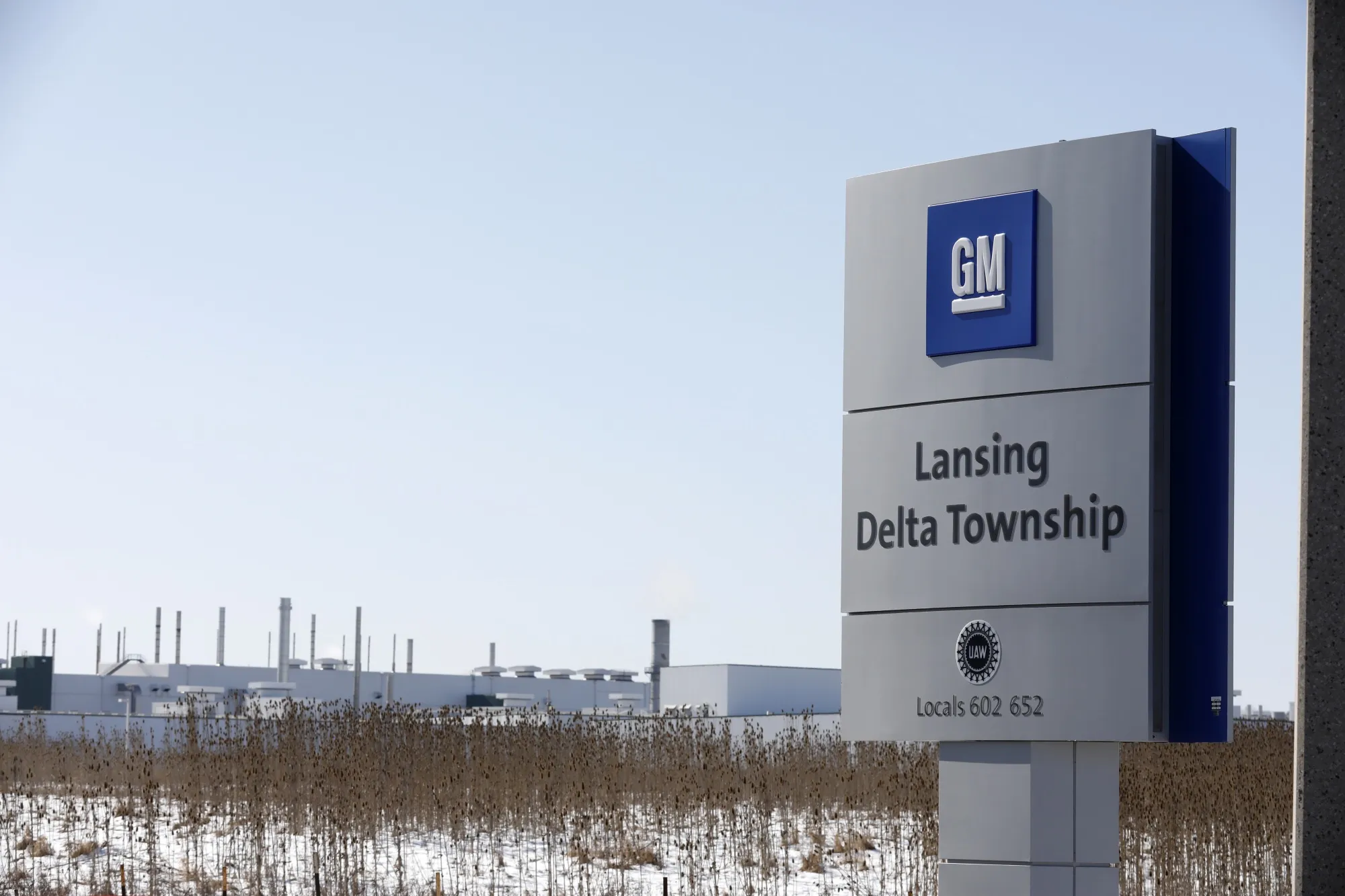 Signage is displayed outside the General Motors Co. Lansing Delta Township Assembly Plant stands in Lansing, Michigan, U.S.