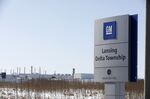Signage is displayed outside the General Motors Co. Lansing Delta Township Assembly Plant stands in Lansing, Michigan, U.S.