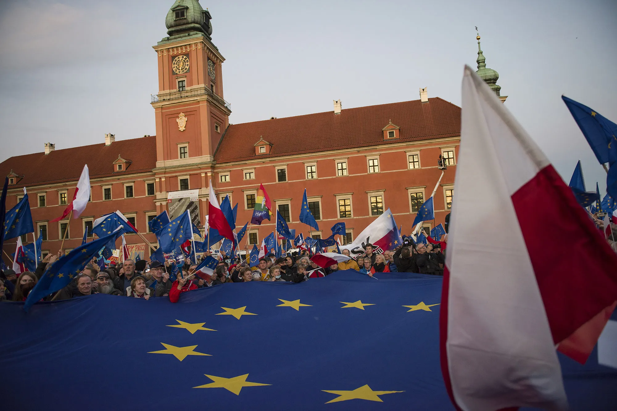 Protesters hold EU and Polish flags during the pro-EU rally