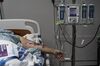 A patient is lying on a bed in a Covid-19 ICU in a hospital in Houston, Texas.