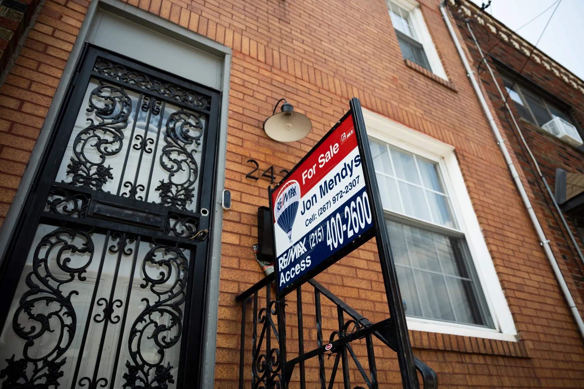 A "For Sale" sign on a house in Philadelphia, Pennsylvania, US, on Friday, Aug. 16, 2024.&nbsp;