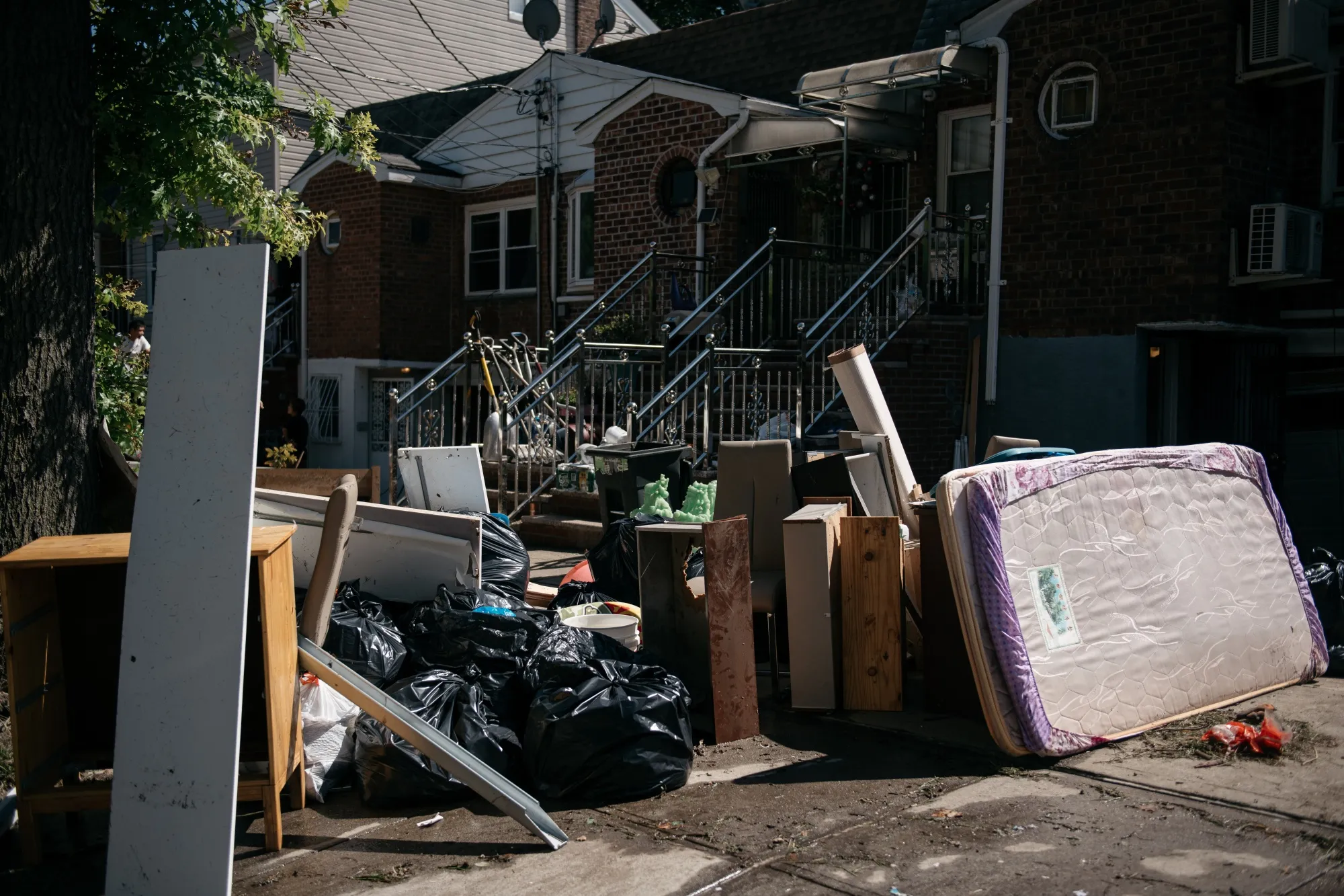 Damaged and destroyed items outside of a home&nbsp;after&nbsp;heavy rain and wind caused many homes to flood in the Queens borough of New York, on Sept. 2.