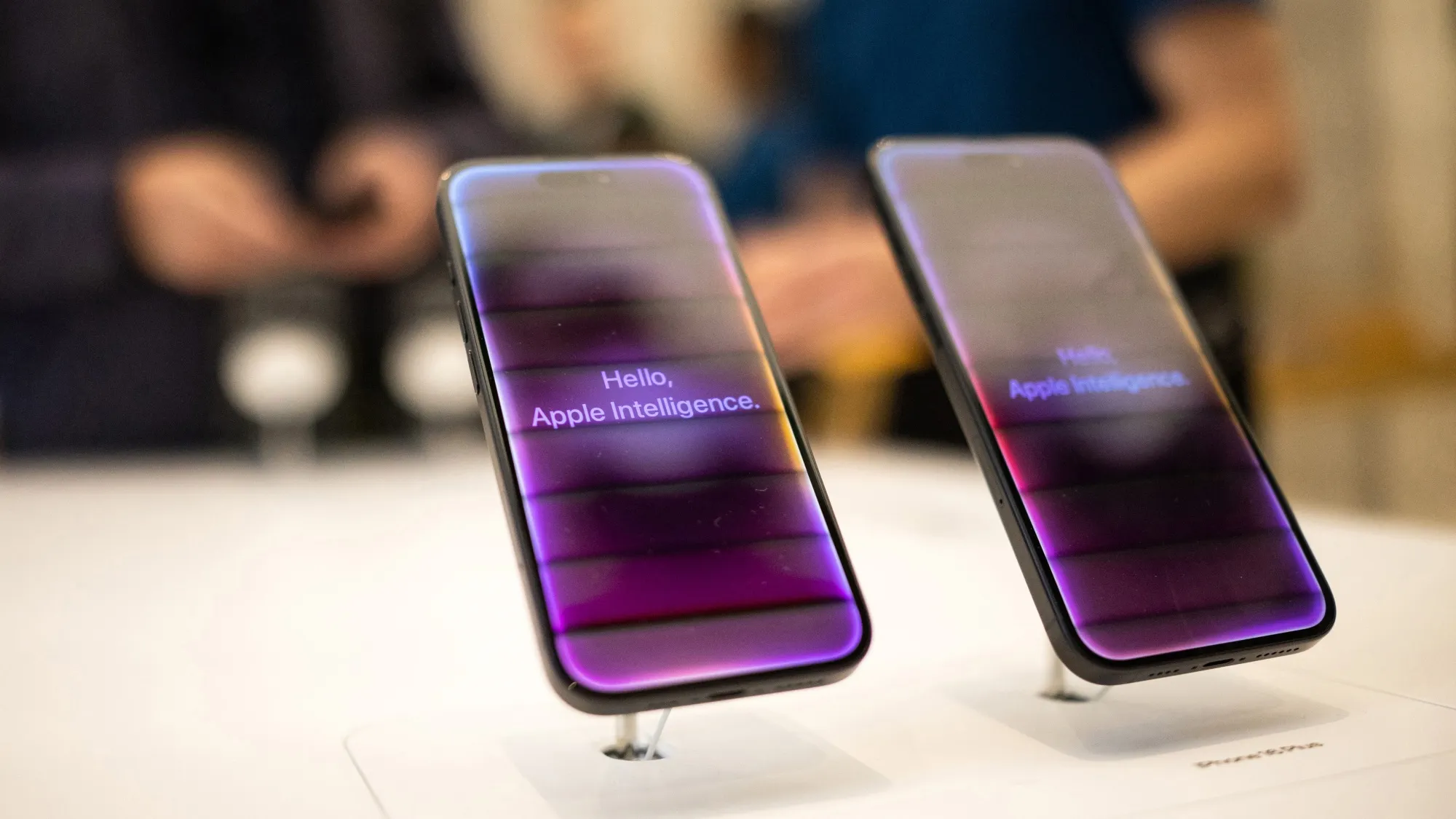 Artificial Intelligence welcome screens on iPhone 16 smartphones in an Apple Inc. store in London.