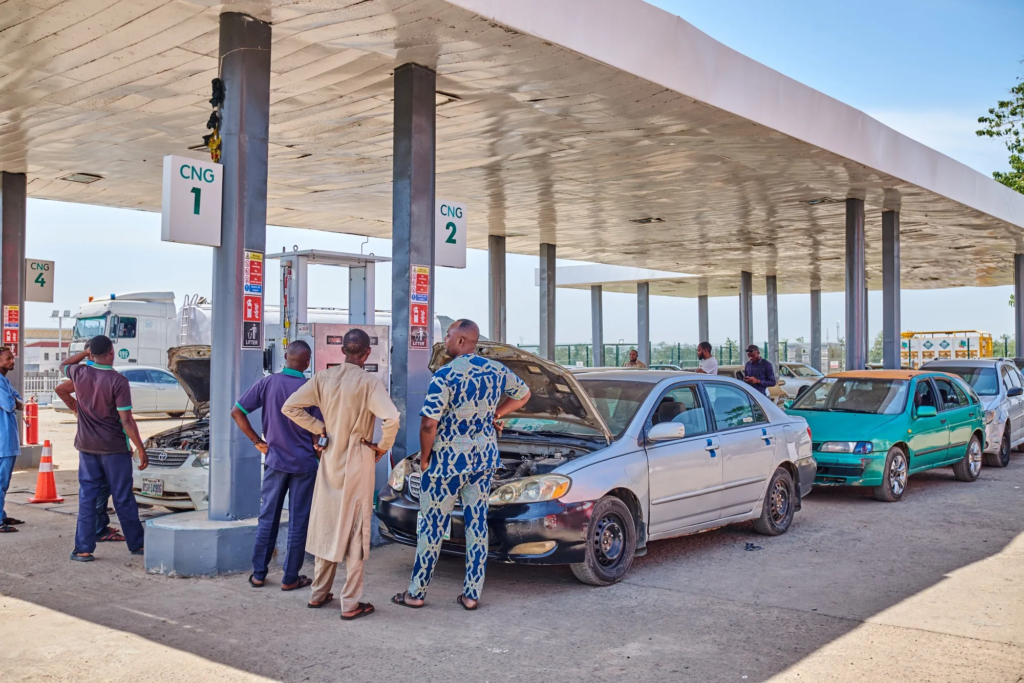 Customers refuel their vehicles with CNG in Abuja.