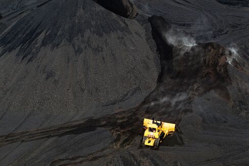 A bulldozer moves coal at a coal mine in Carlinville, Ill.