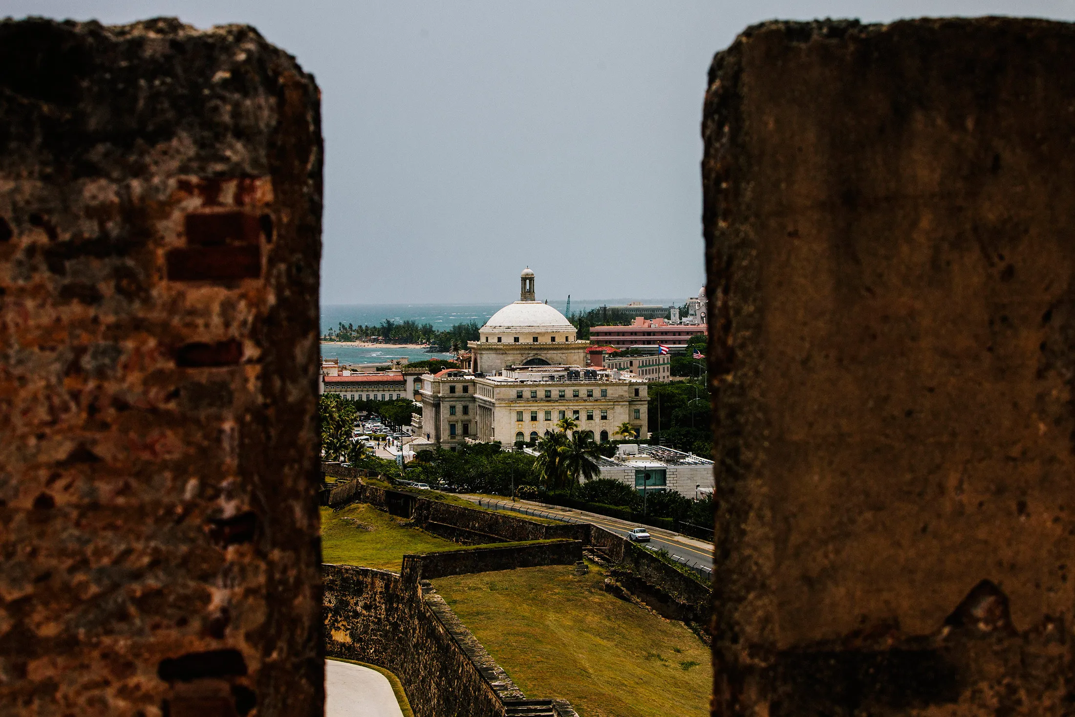 The Capitol Building is seen past walls in the Old City of San Juan, Puerto Rico, on July 8, 2015.
