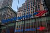 Building are seen reflected on the exterior of a Bank of America Corp. branch in New York, U.S., on Monday, Jan. 15, 2018. Bank of America Corp. is scheduled to release earnings figures on January 17.