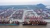 An A.P Moller-Maersk A/S container ship, left, and the Mediterranean Shipping Co. (MSC) Anzu container ship are docked next to gantry cranes as shipping containers sit stacked at the Yangshan Deepwater Port, operated by Shanghai International Port Group Co. (SIPG), in this aerial photograph taken in Shanghai, China, on Friday, May 10, 2019. The U.S. hiked tariffs on more than $200 billion in goods from China on Friday in the most dramatic step yet of President Donald Trump's push to extract trade concessions, deepening a conflict that has roiled financial markets and cast a shadow over the global economy.