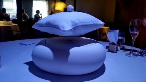 Dessert floats on a pillow above the table at the Fat Duck. There are no hidden wires.