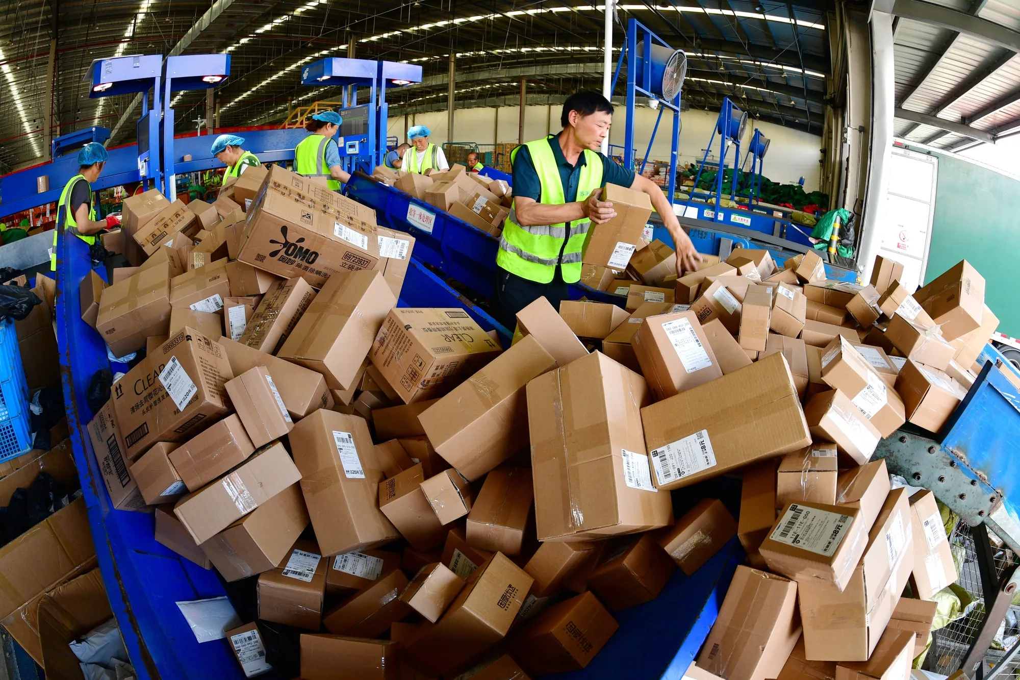 Workers sort parcels for the 618 Online Shopping Festival on an assembly line in&nbsp;Jiangsu province on&nbsp;June 18.