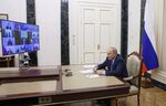 Vladimir Putin chairs a meeting on the development of the oil industry via a video link in Moscow on May 17.