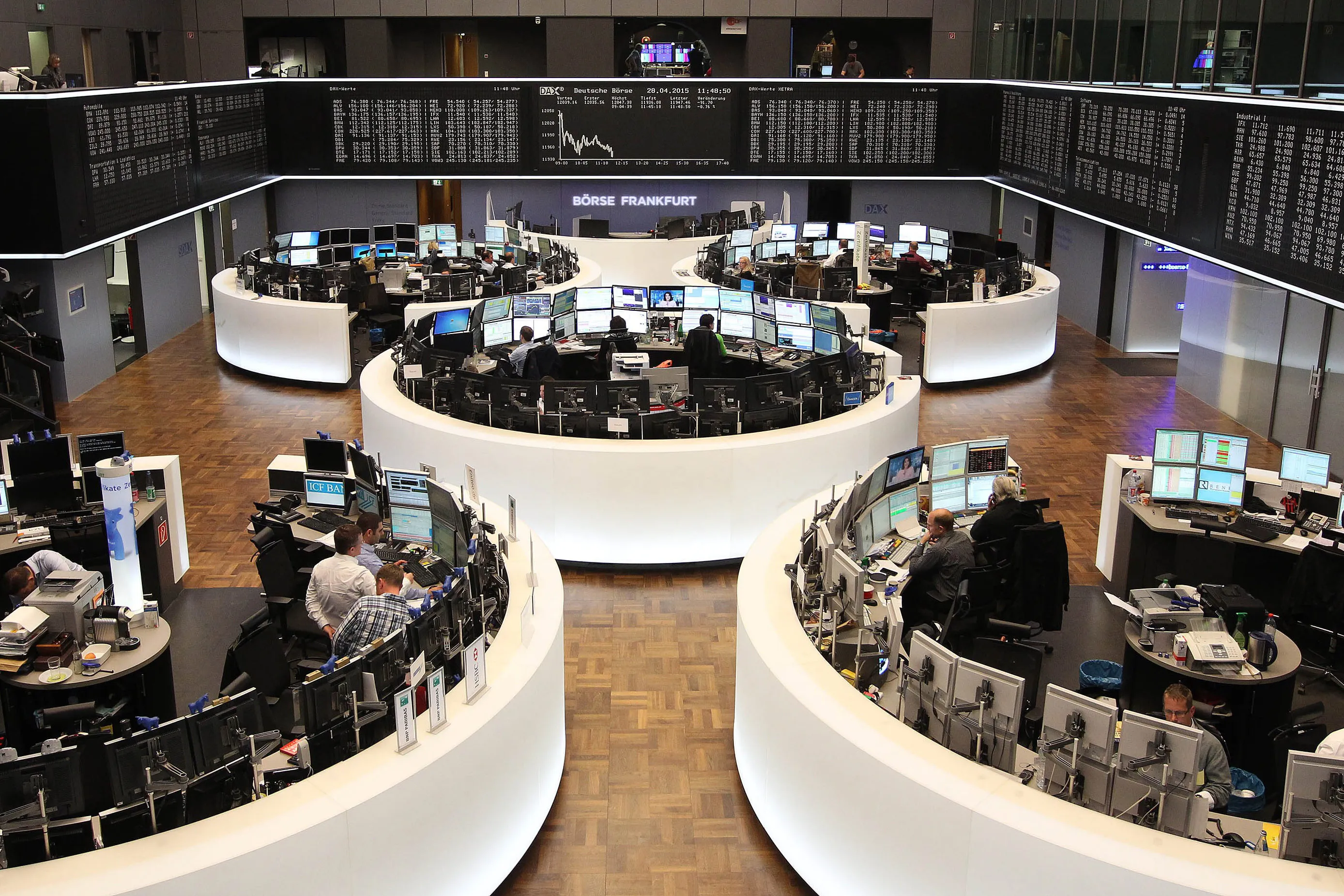 Traders work at the German Stock Exchange in Frankfurt.
