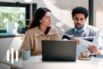 Young couple cooperating while going through their home finances - Homepage Image