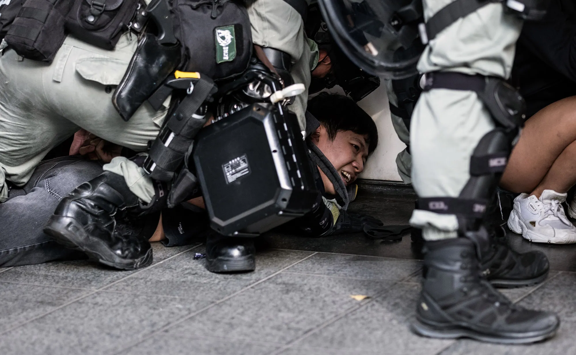 Riot police detain a man during a protest in the Central district of Hong Kong on&nbsp;Nov. 12.&nbsp;