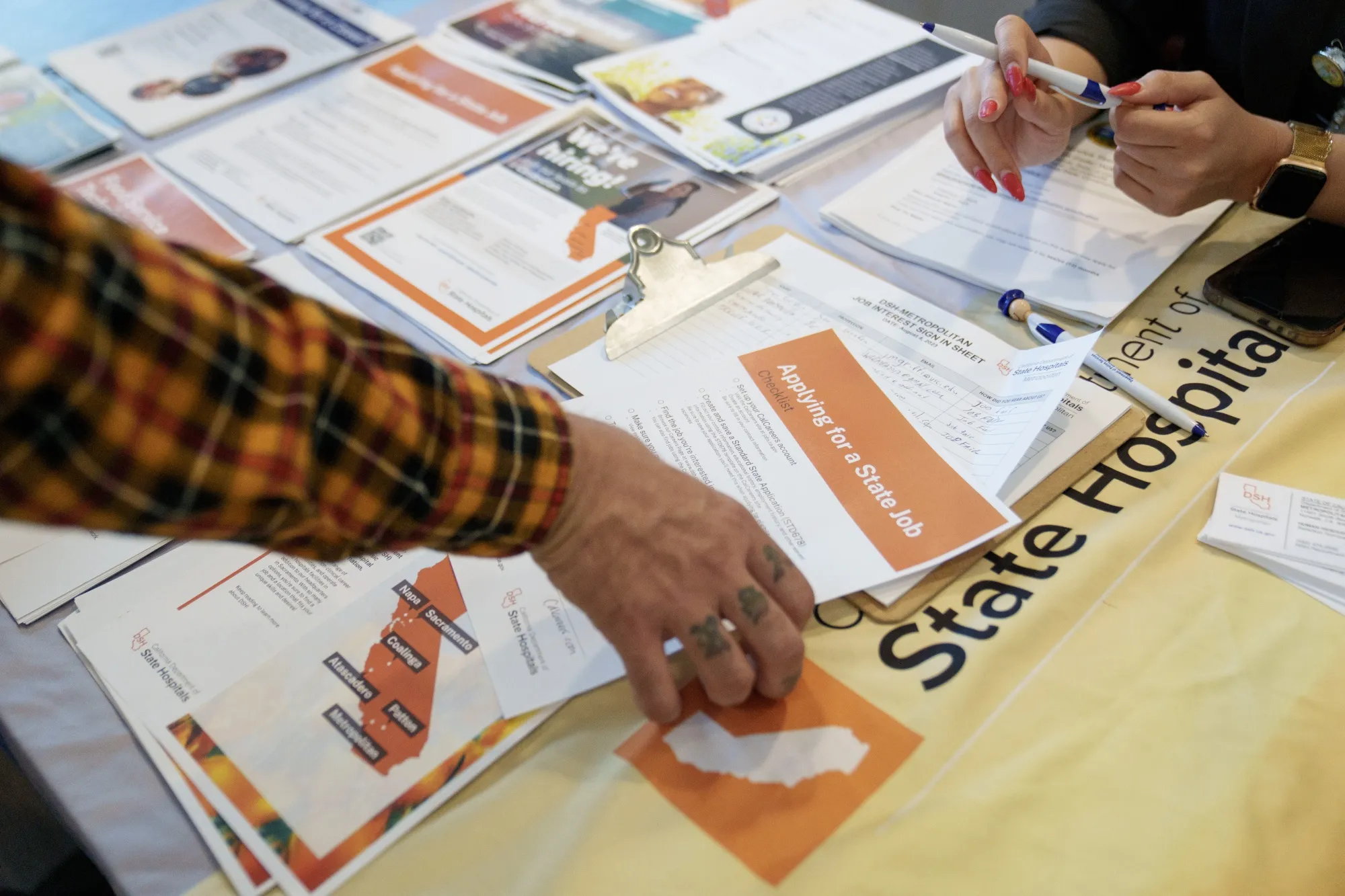 Job seekers attend a Veteran Employment and Resource Fair in Long Beach, California.