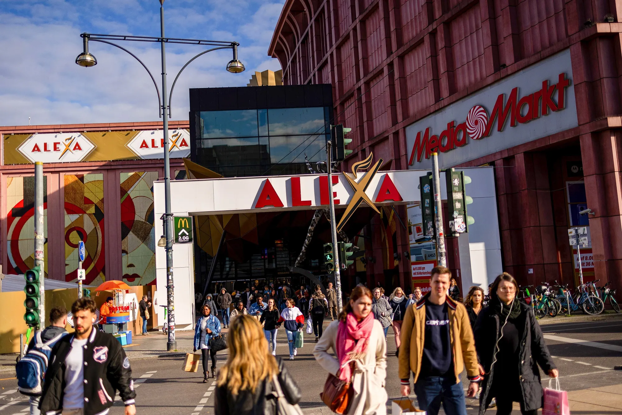 Shoppers at an entrance to the Alexa shopping mall in Berlin, Germany.