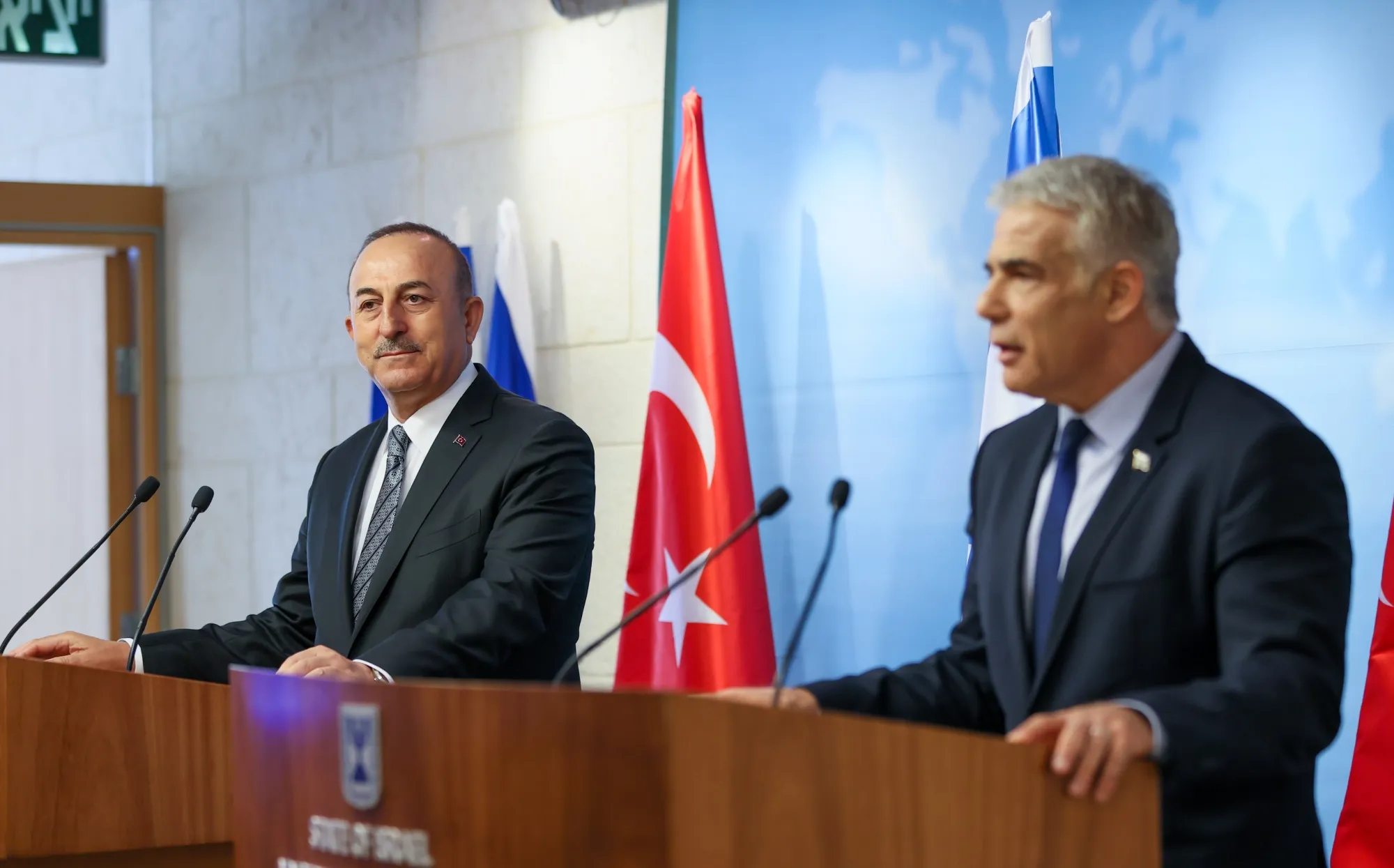 Mevlut Cavusoglu, left, and Yair Lapid in Jerusalem on May 25.