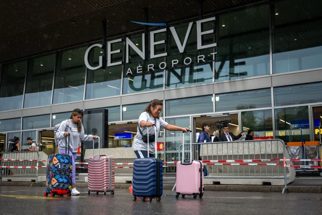 Travelers arrives at Geneva's international airport during strikes on June 30.&nbsp;
