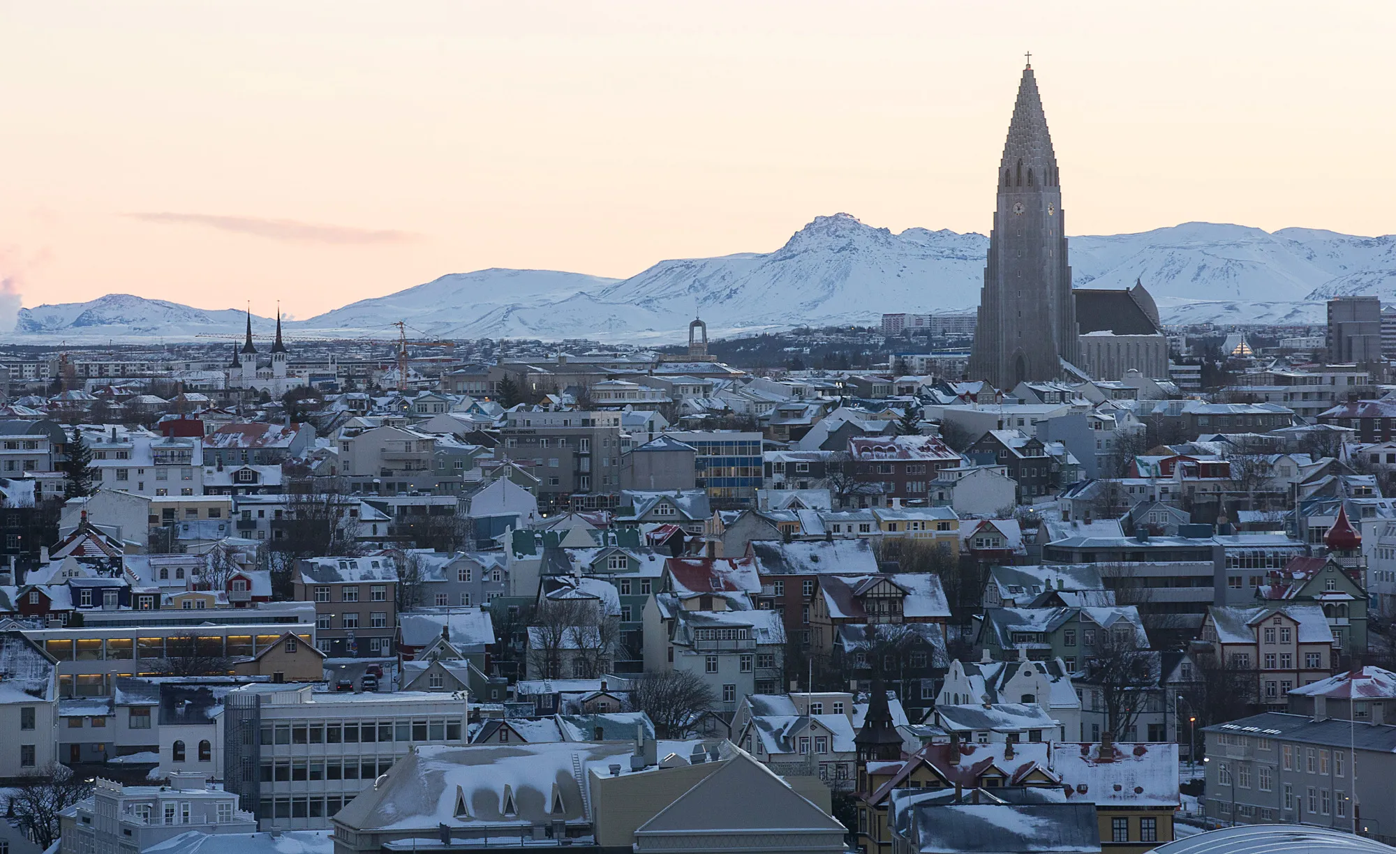 The spire of Hallgrimskirkja church, right, stand above residential and commercial property on the city skyline in Reykjavik, Iceland, on Thursday, Jan. 14, 2016. Iceland's prime minister expects hedge funds to pay their 'fair share' as the country prepares to dismantle the final barriers to free capital flows.

