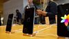 An Apple Inc. iPhone XS Max, center, and iPhone XS smartphones