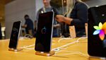An Apple Inc. iPhone XS Max, center, and iPhone XS smartphones