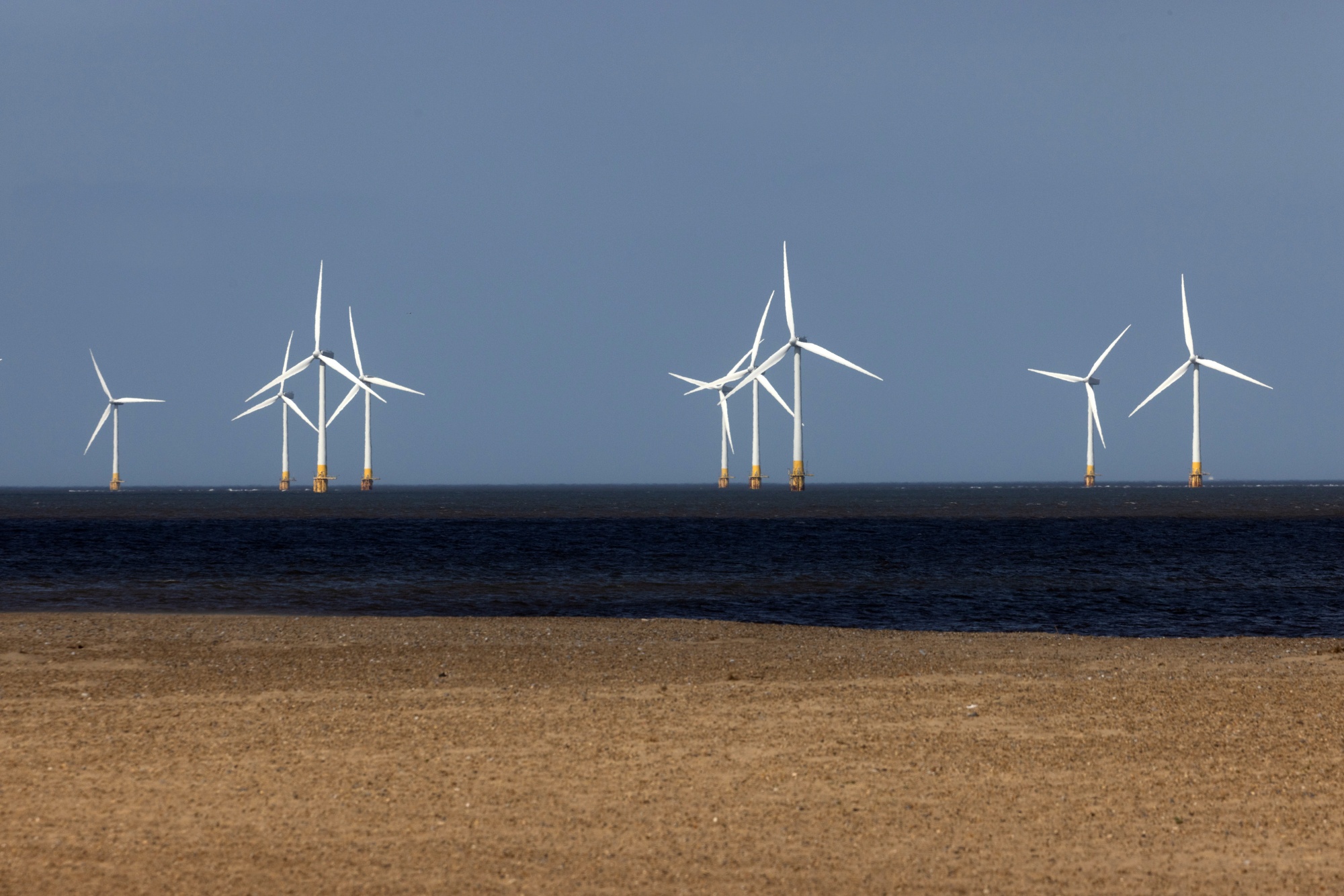 Offshore wind projects use large turbines to tap into stronger winds off the coasts.