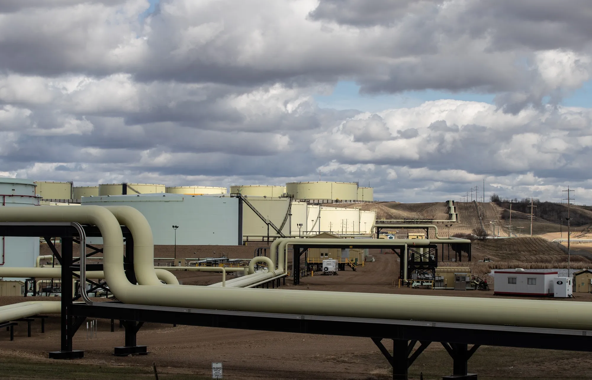 Oil storage containers and pipelines at a terminal in Hardisty, Alberta.