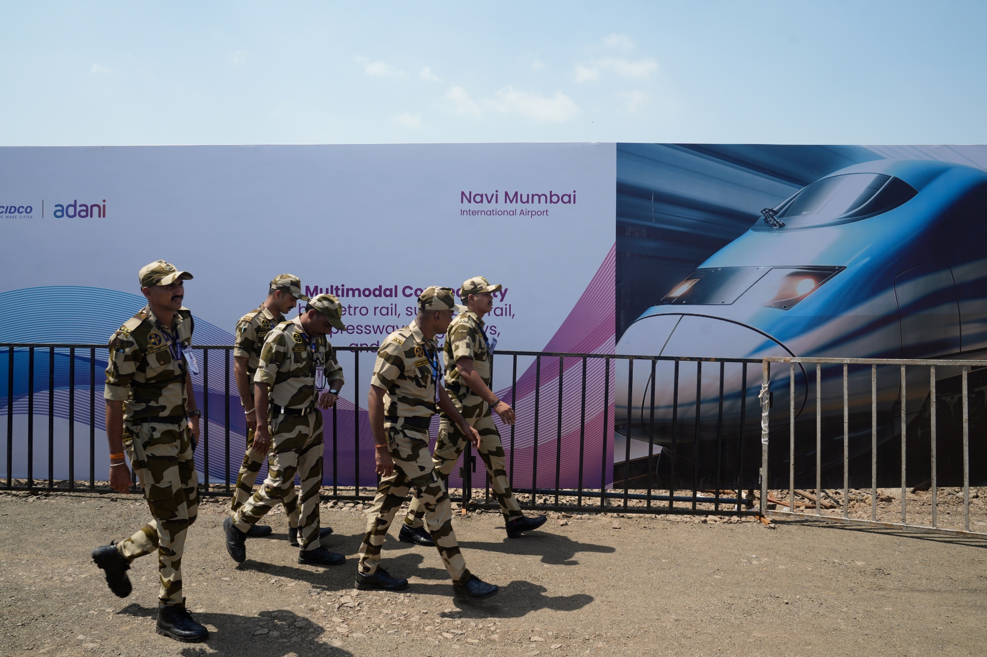 Security forces near the Navi Mumbai International Airport in Mumbai, India, on Wednesday, Oct. 8, 2025. Indian Prime Minister Narendra Modi inaugurated two landmark transit projects worth nearly $4 billion today, marking another milestone in his administration's effort to modernize infrastructure in the world's most populous country.